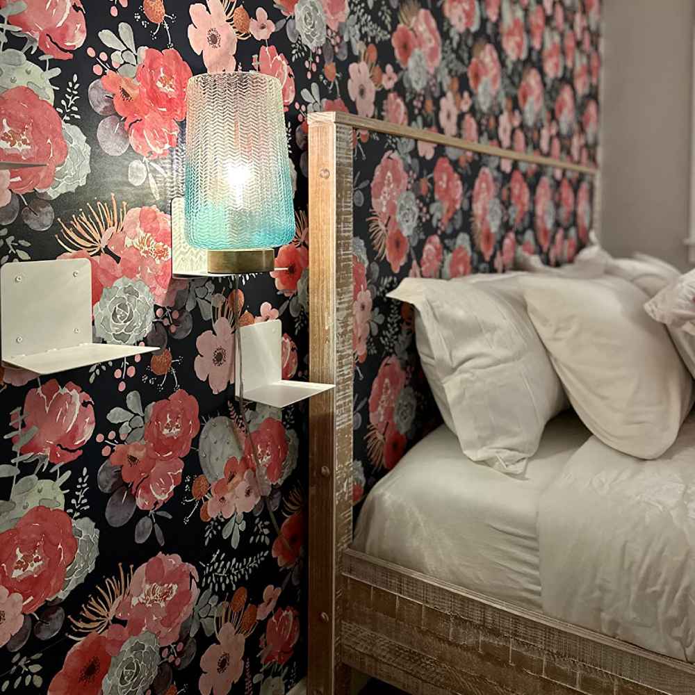 Floral peel and stick wallpaper on a bedroom wall